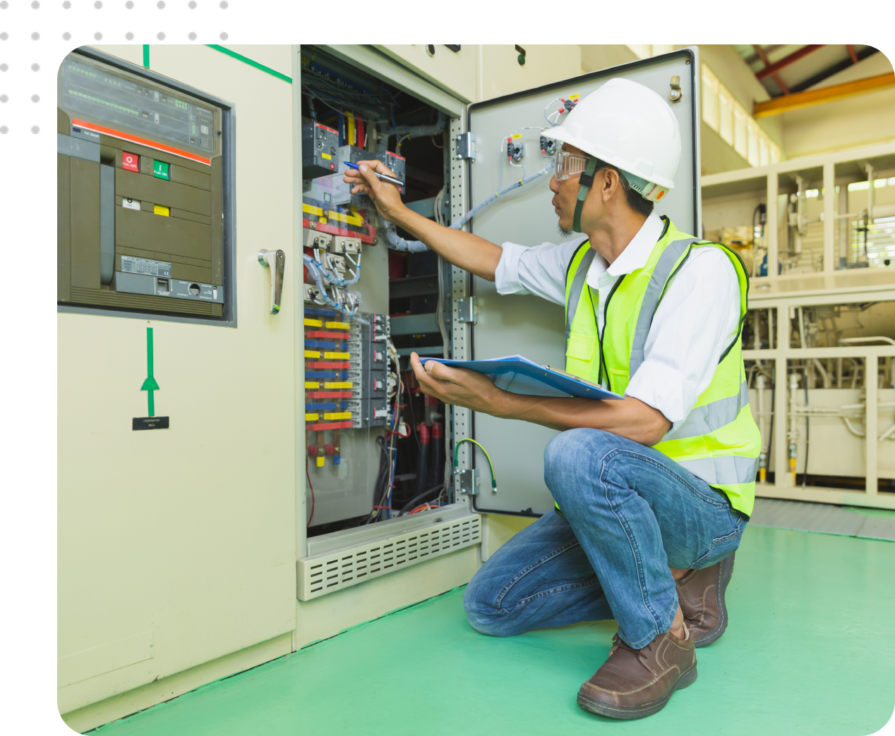 Technician inspecting electrical panel and notes.