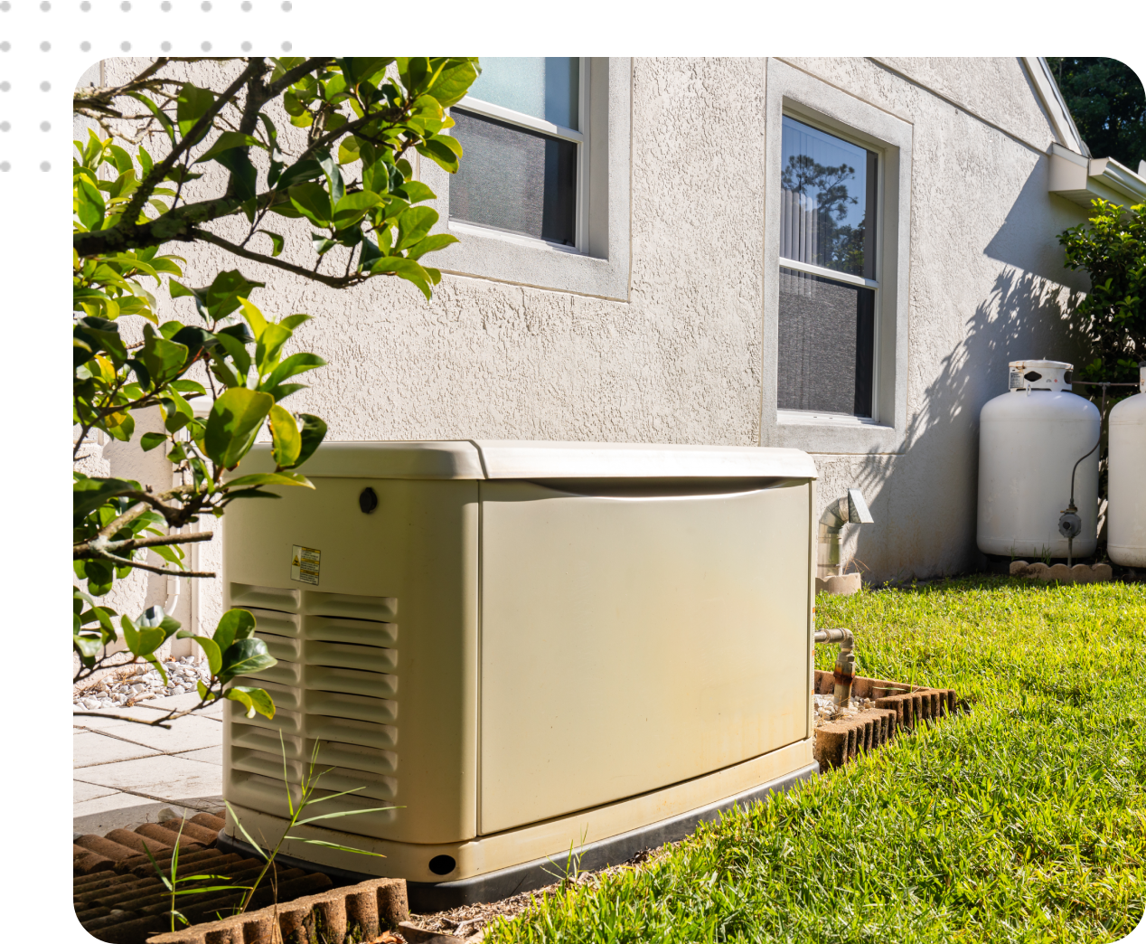 Home standby generator and propane tanks.